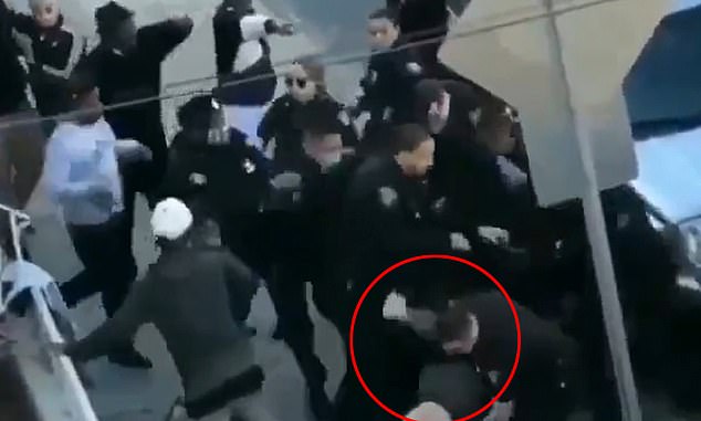 Shocking video shows white cop repeatedly beating a black man while another pins him to the ground ‘for not following social distancing rules’ – despite the officers not wearing masks themselves