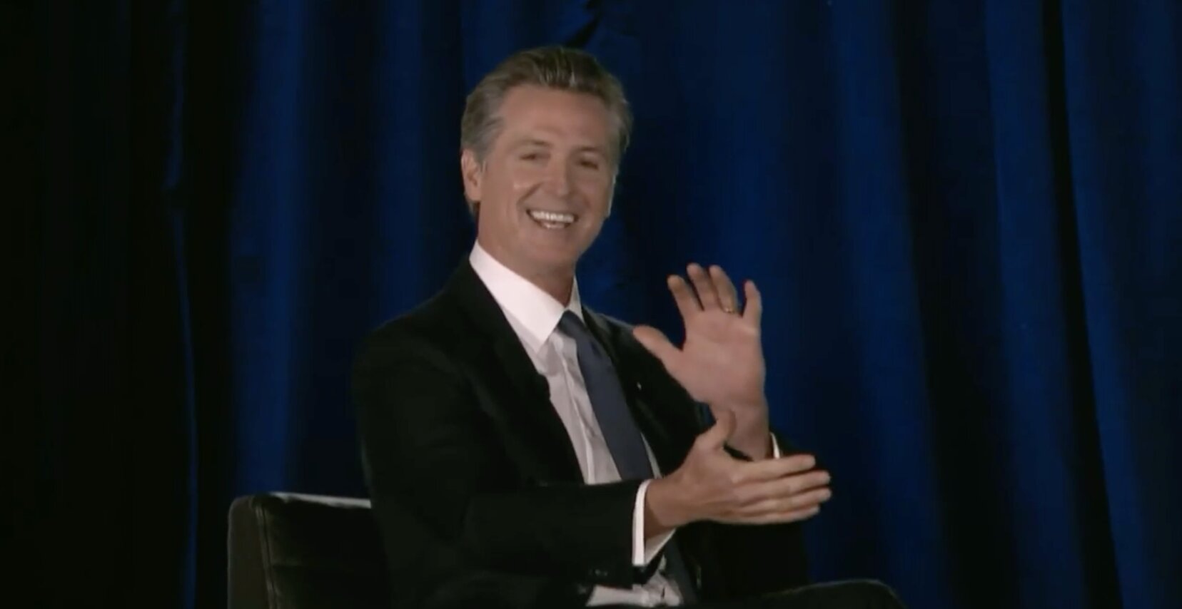LO and BEHOLD Gavin Newsom all of the sudden makes public appearance…SITTING DOWN! Says he skipped climate change summit “to spend Halloween with family”